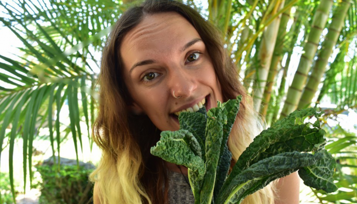 Girl eating raw kale